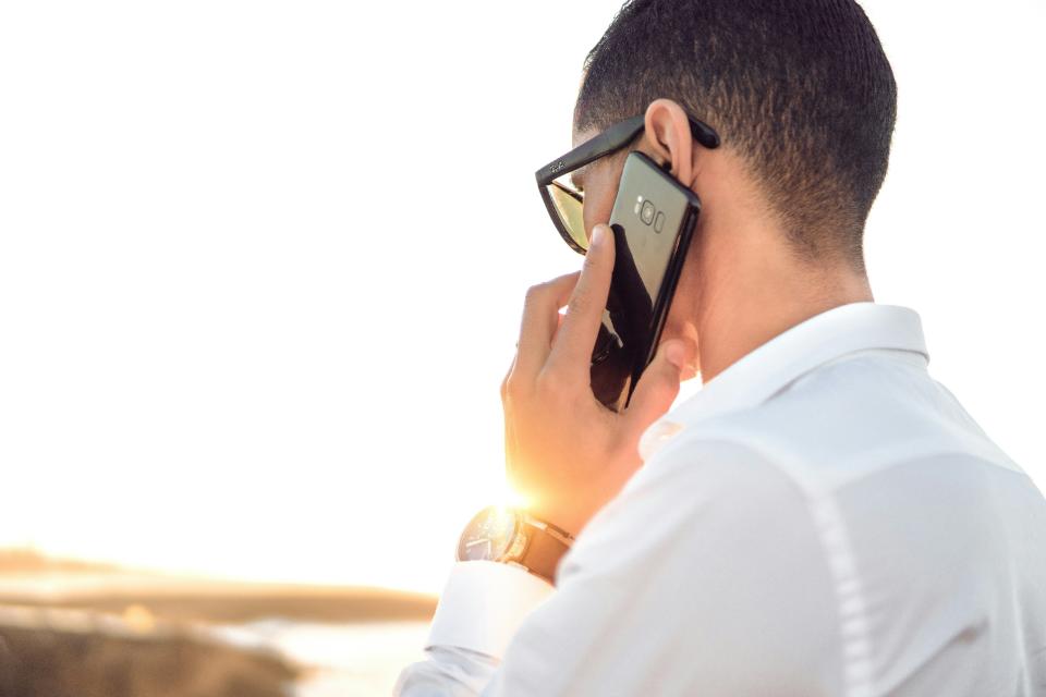 Person talking on a smartphone outdoors